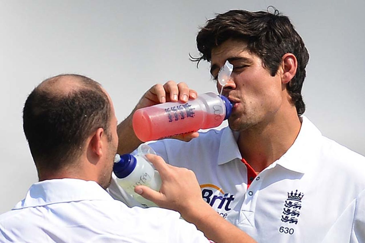 Alastair Cook and Jonathan Trott take a break during play, India A v England XI, tour match, Mumbai, 2nd day, October 31, 2012