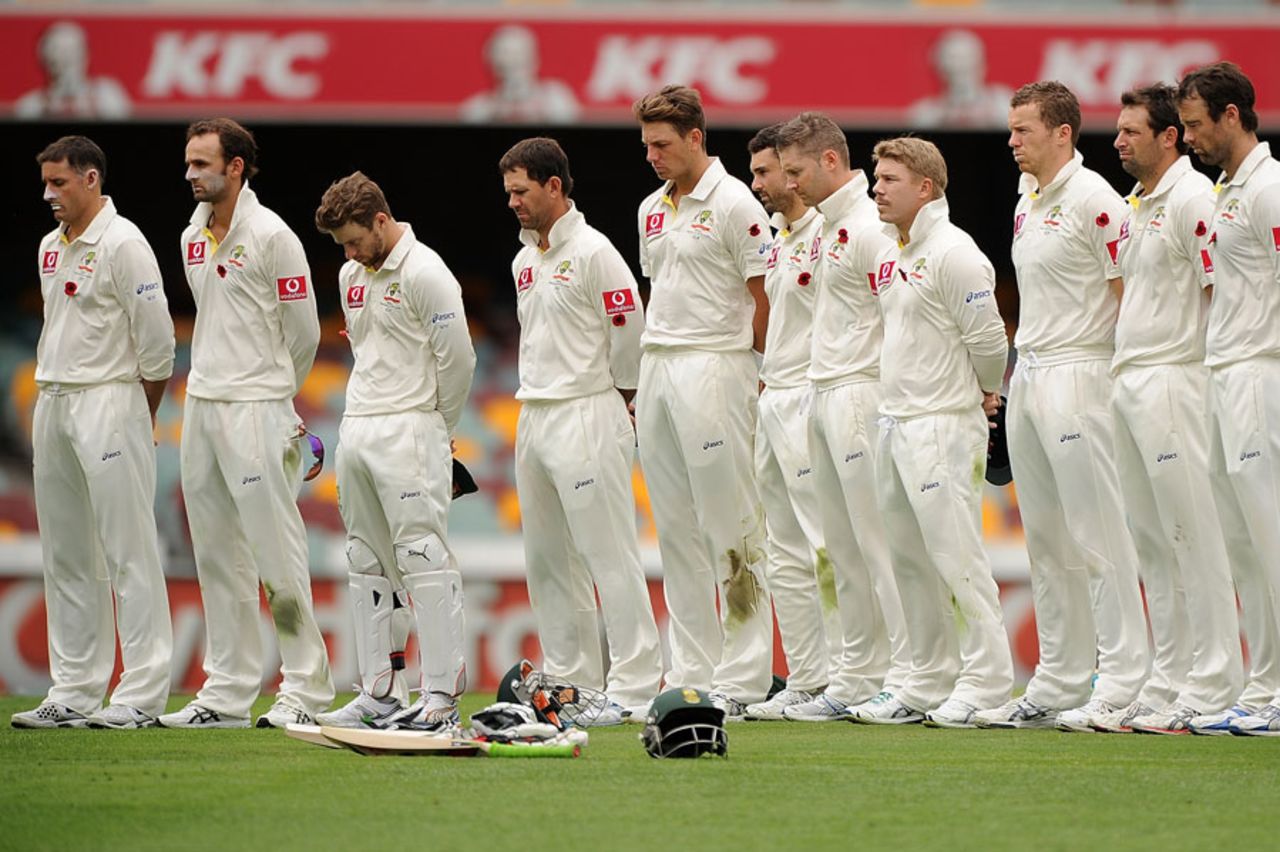 The Australia team observe a minute's silence to commemorate Remembrance Day, Australia v South Africa, first Test, day three, Brisbane, November 11, 2012