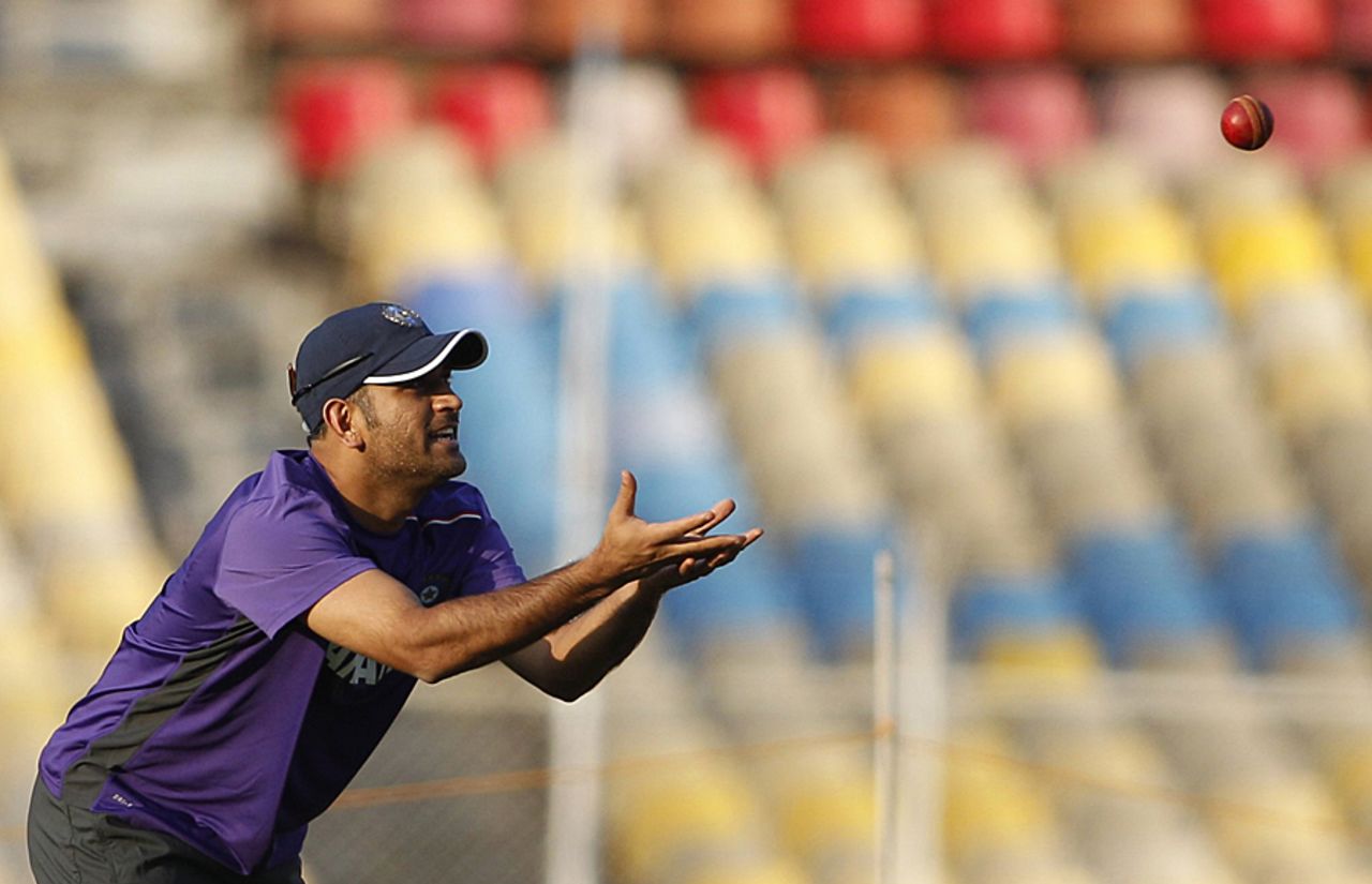 MS Dhoni prepares to catch a ball during practice, Ahmedabad, November 12, 2012