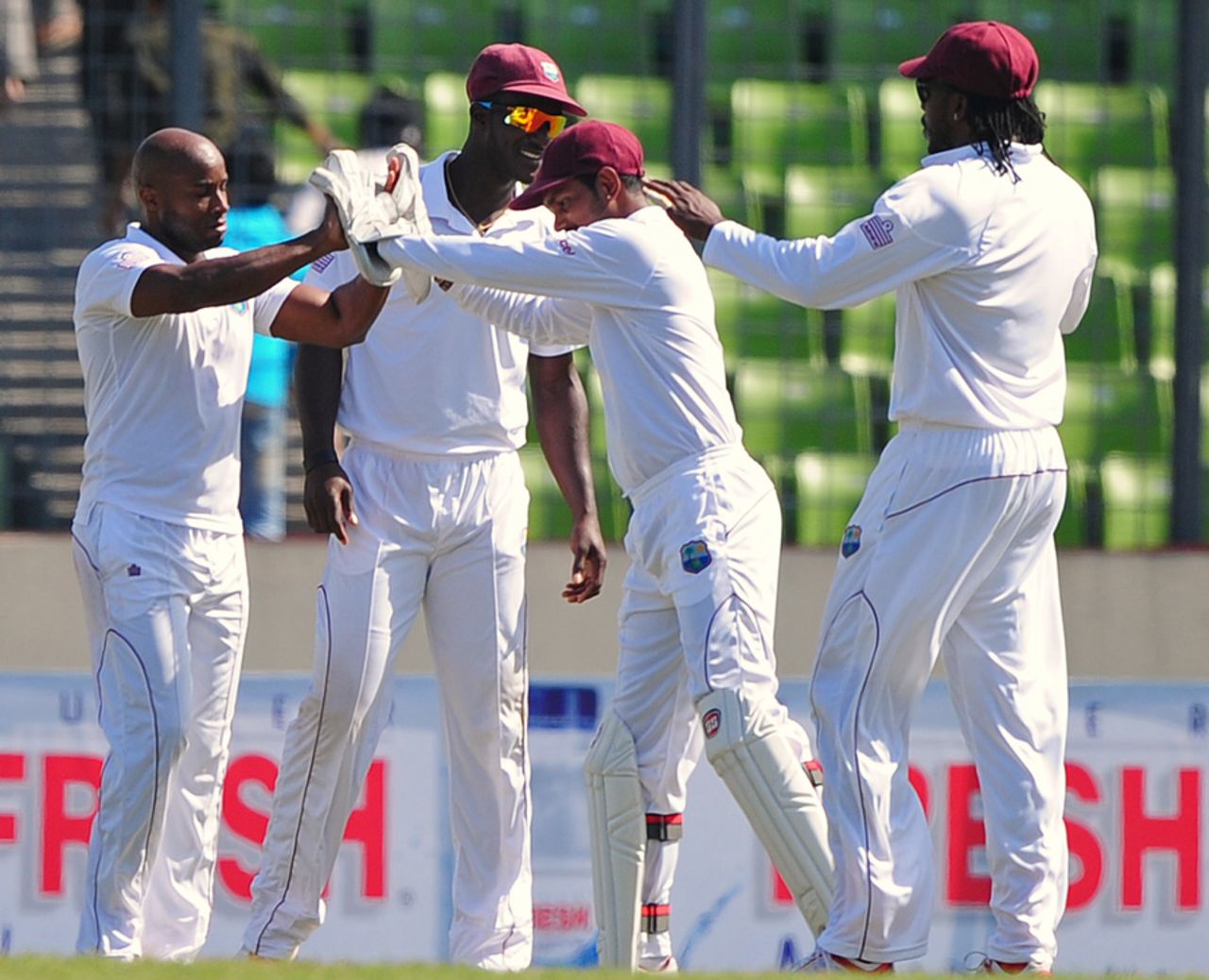 Tino Best is congratulated by his team-mates after a strike, Bangladesh v West Indies, 1st Test, Mirpur, 5th day, November 17, 2012