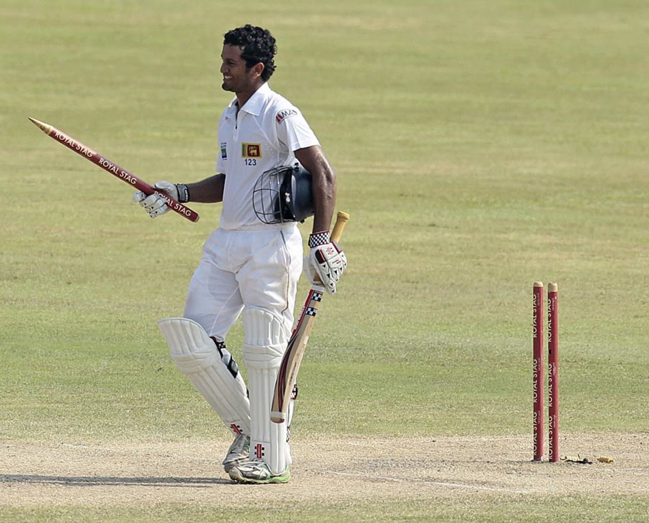 Dimuth Karunaratne takes off a stump after taking Sri Lanka to victory, Sri Lanka v New Zealand, 1st Test, Galle, 3rd day, November 19, 2012