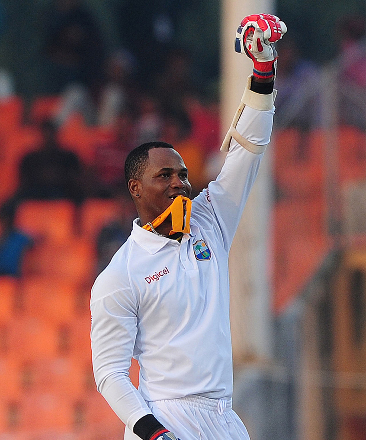 Marlon Samuels takes out his yellow scarf after scoring a century, Bangladesh v West Indies, 2nd Test, Khulna, 2nd day, November 22, 2012