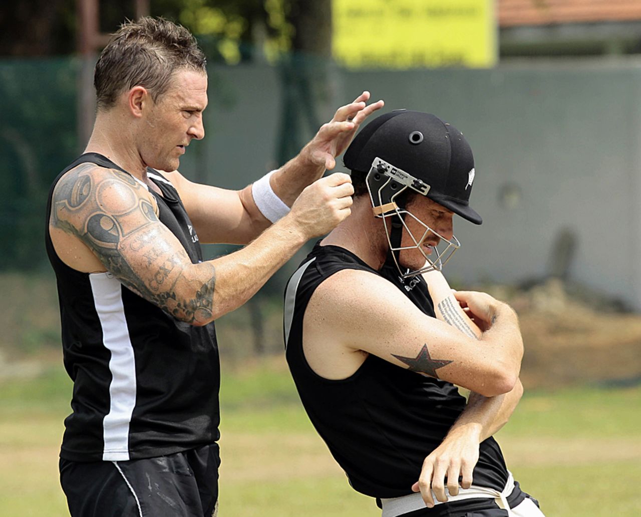 Brendon McCullum adjusts Rob Nicol's helmet at practice, Colombo, November 23, 2012
