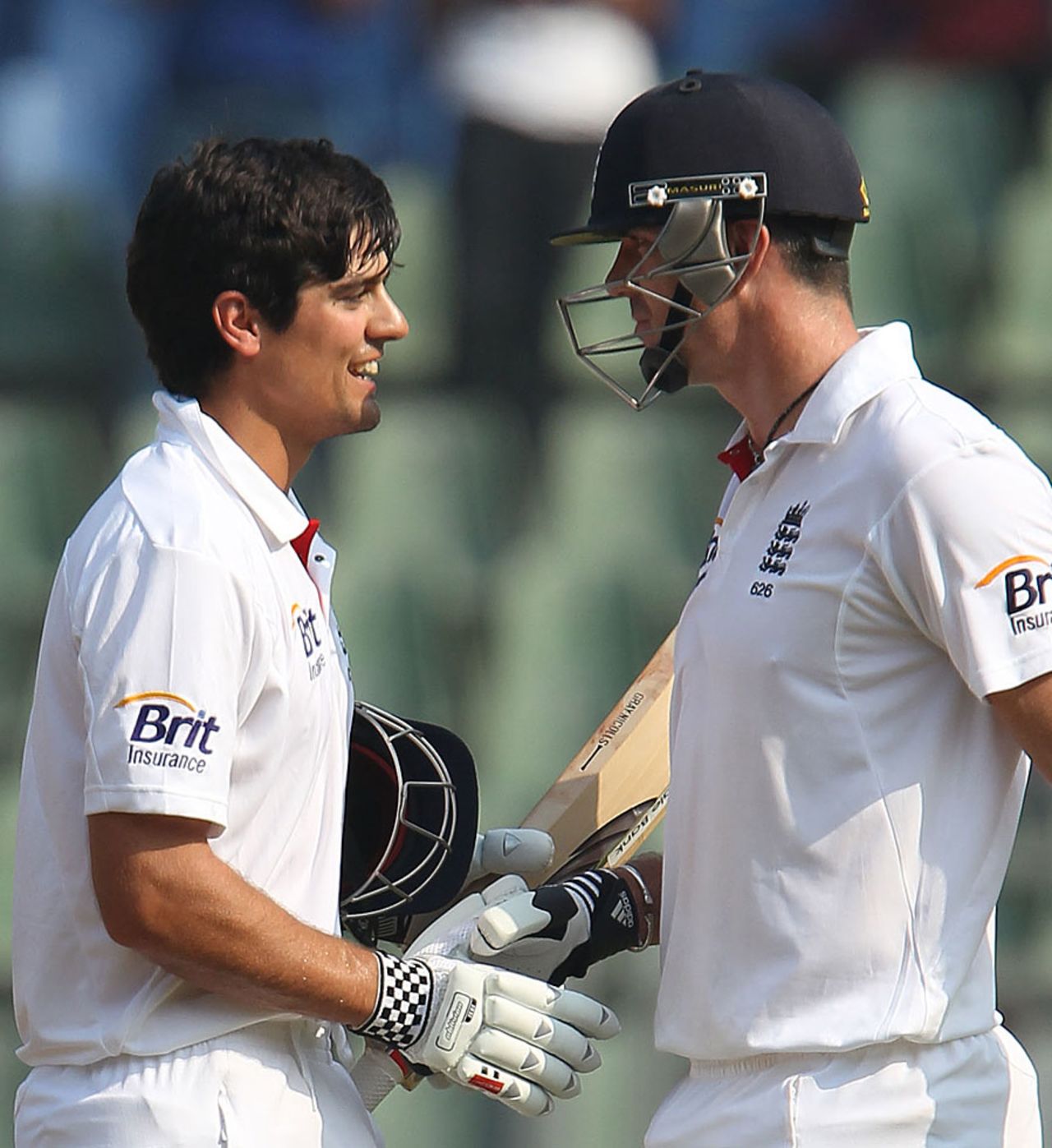 Alastair Cook gets a handshake from Kevin Pietersen after reaching his century, India v England, 2nd Test, Mumbai, 2nd day, November 25, 2012