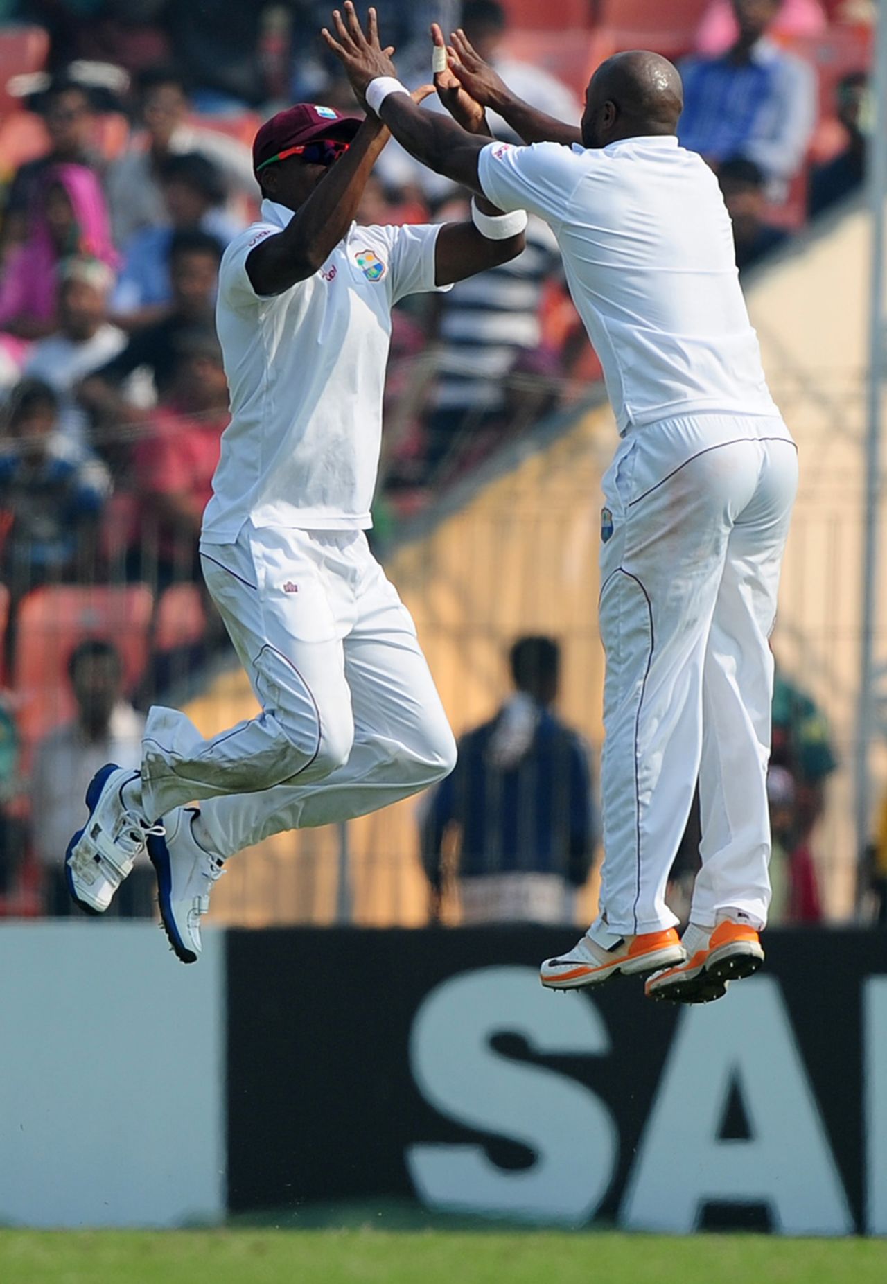 Tino Best and Darren Bravo do an airborne high-five, Bangladesh v West Indies, 2nd Test, Khulna, 5th day, November 25, 2012