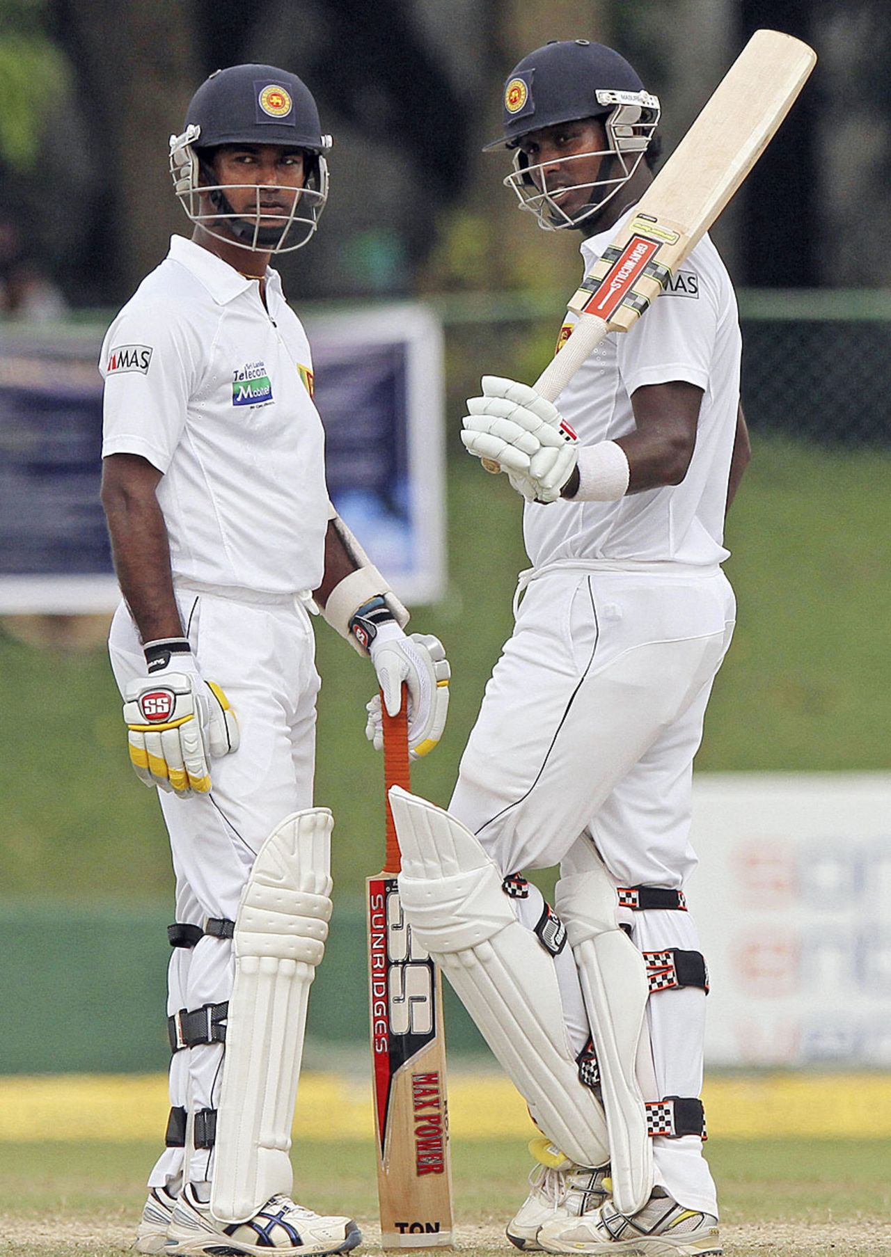 Angelo Mathews acknowledges his fifty as Nuwan Kulasekara looks on, Sri Lanka v New Zealand, 2nd Test, Colombo, 5th day, November 29, 2012
