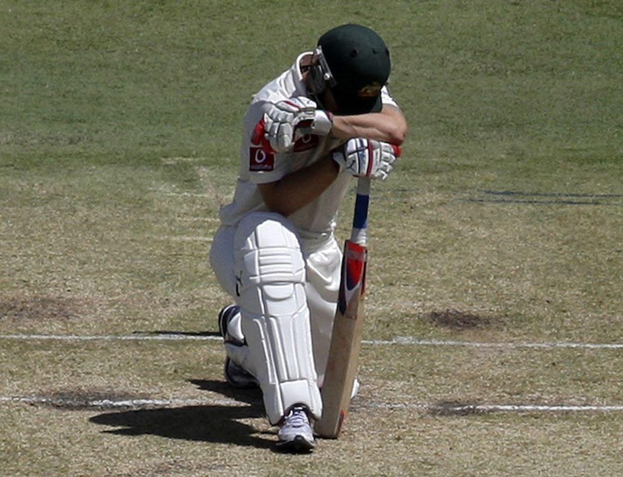 Matthew Wade kneels over his bat after he was bowled, Australia v South Africa, 3rd Test, 2nd day, Perth, December 1, 2012
