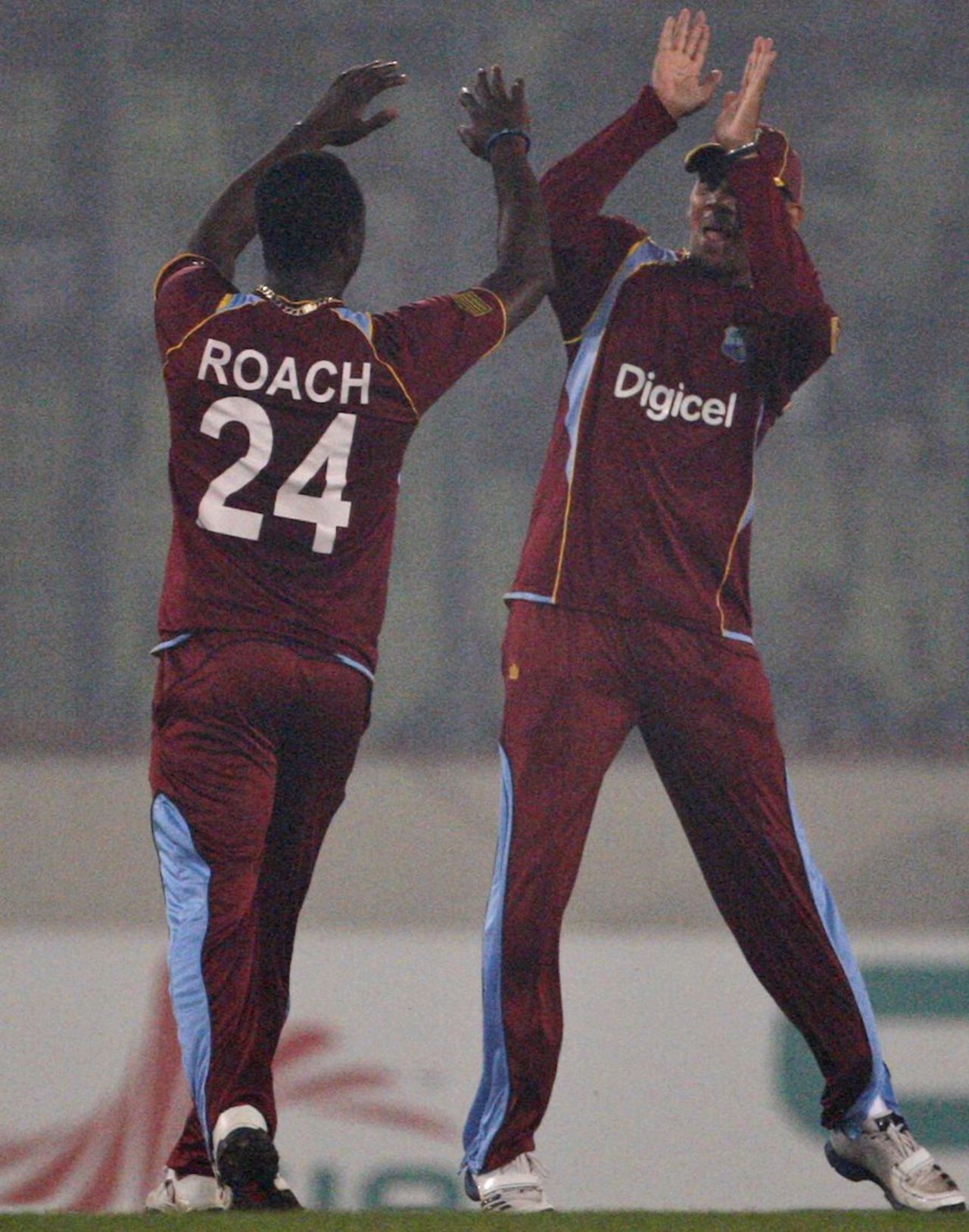 Kemar Roach and Sunil Narine celebrate a wicket, Bangladesh v West Indies, 5th ODI, Mirpur, December 8, 2012