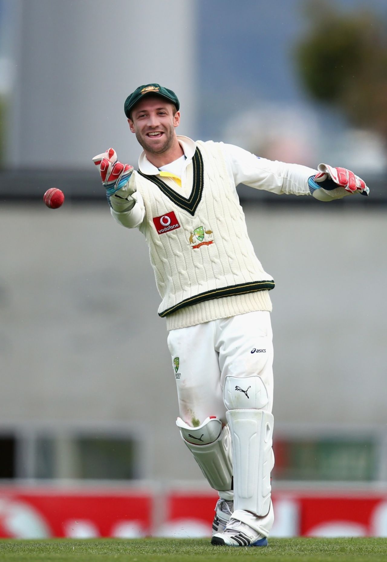 Phillip Hughes keeps wicket while Matthew Wade bowls, Australia v Sri Lanka, 1st Test, Hobart, 5th day, December 18, 2012