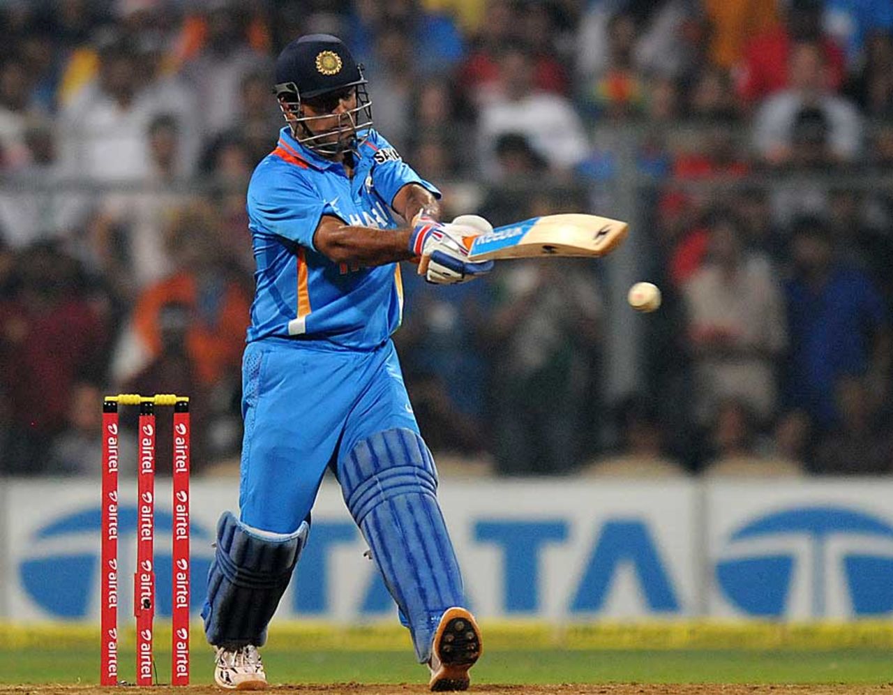 MS Dhoni swings his arms, India v England, 2nd Twenty20 international, Mumbai, December 22, 2012