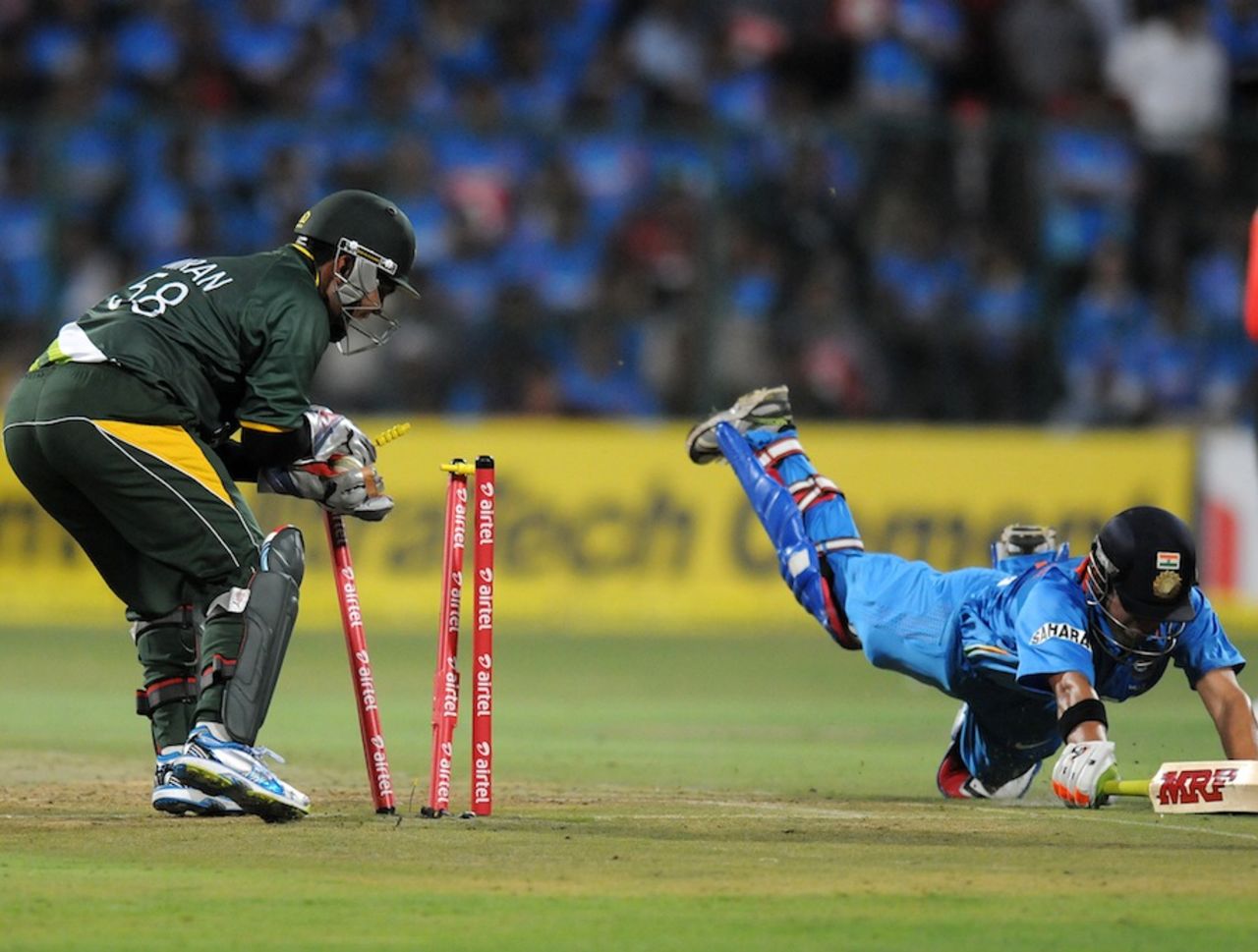 Gautam Gambhir dives in vain as Kamran Akmal flicks the bails, India v Pakistan, 1st T20, Bangalore, December 25, 2012