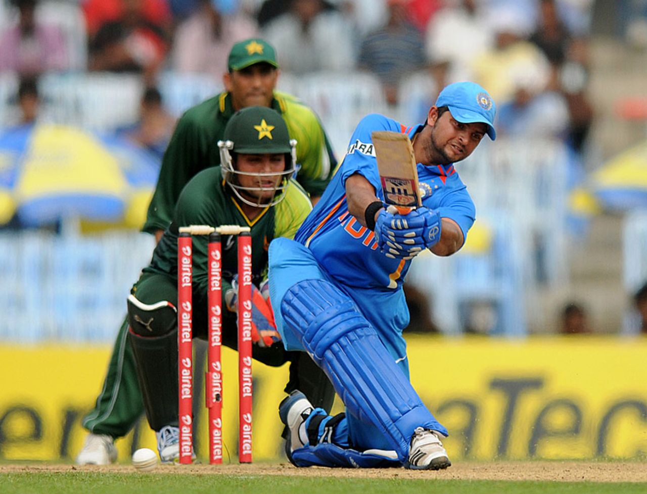 Suresh Raina tries to go over the on side, India v Pakistan, 1st ODI, Chennai, December 30, 2012