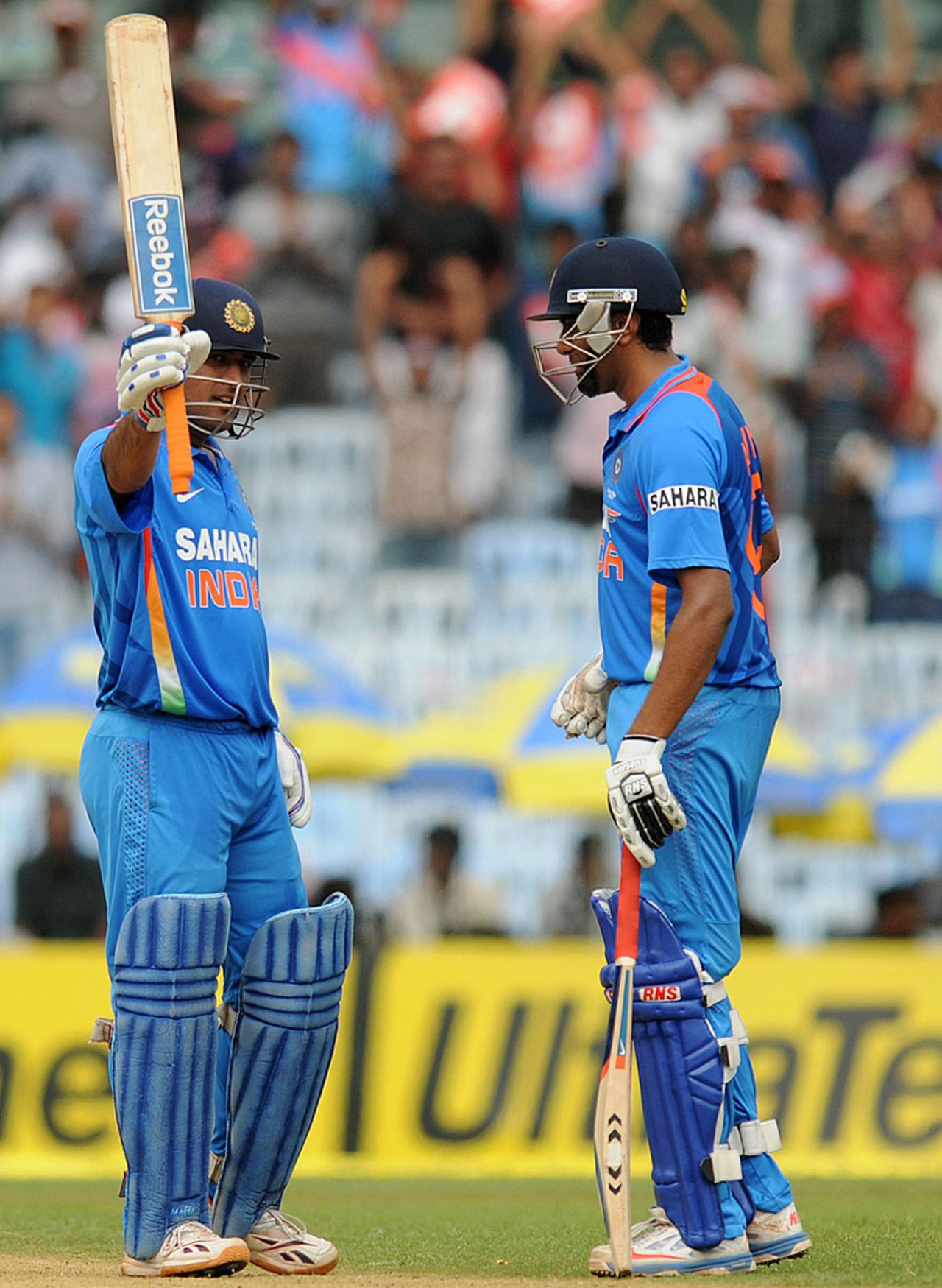 MS Dhoni raises his bat after scoring a century, India v Pakistan, 1st ODI, Chennai, December 30, 2012