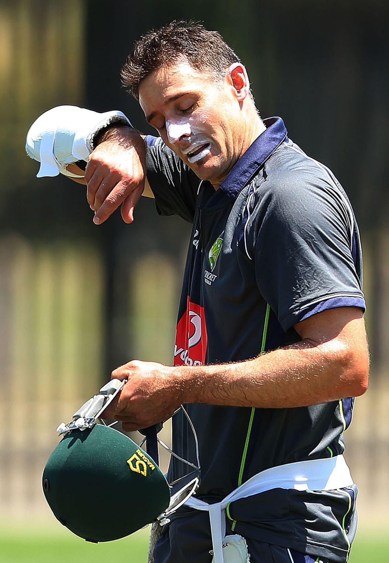Michael Hussey wipes off his sweat during training, Sydney, January 1, 2013