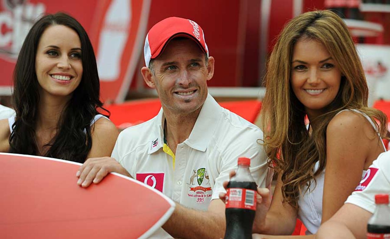 Michael Hussey with models at a promotional event at the SCG, Sydney, January 2, 2012