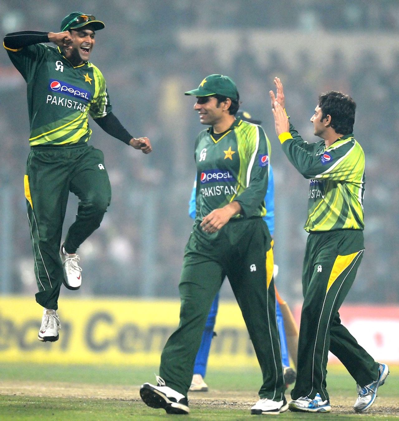 Mohammad Hafeez leaps with joy after Saeed Ajmal strikes, India v Pakistan, 2nd ODI, Kolkata, January 3, 2013