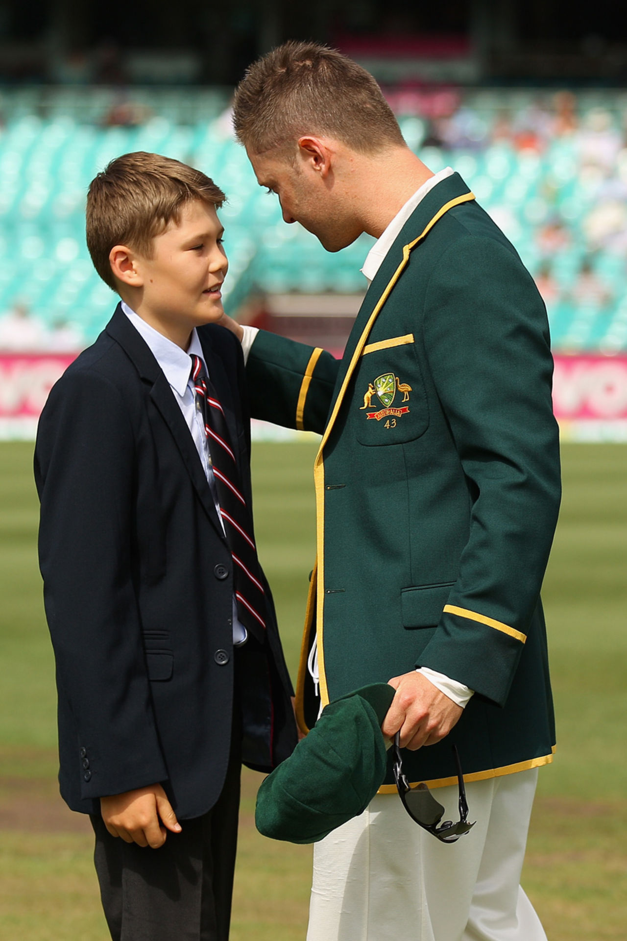 Tony Greig's ten-year-old son Tom talks to Michael Clarke, Australia v Sri Lanka, 3rd Test, Sydney, 1st day, January 3, 2013