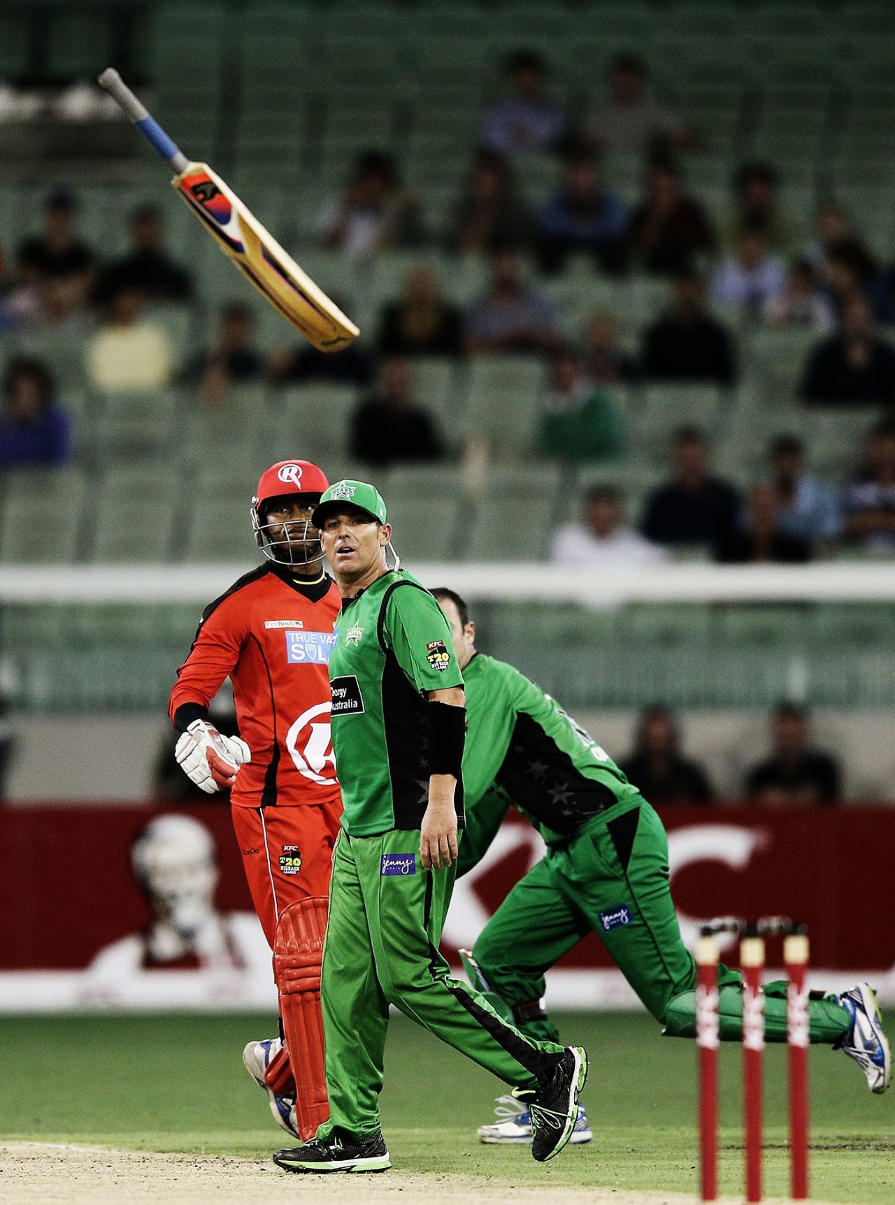 Marlon Samuels throws his bat in the air after getting hit by a throw from Shane Warne, Melbourne Stars v Melbourne Renegades, Big Bash League, MCG, January 6, 2013