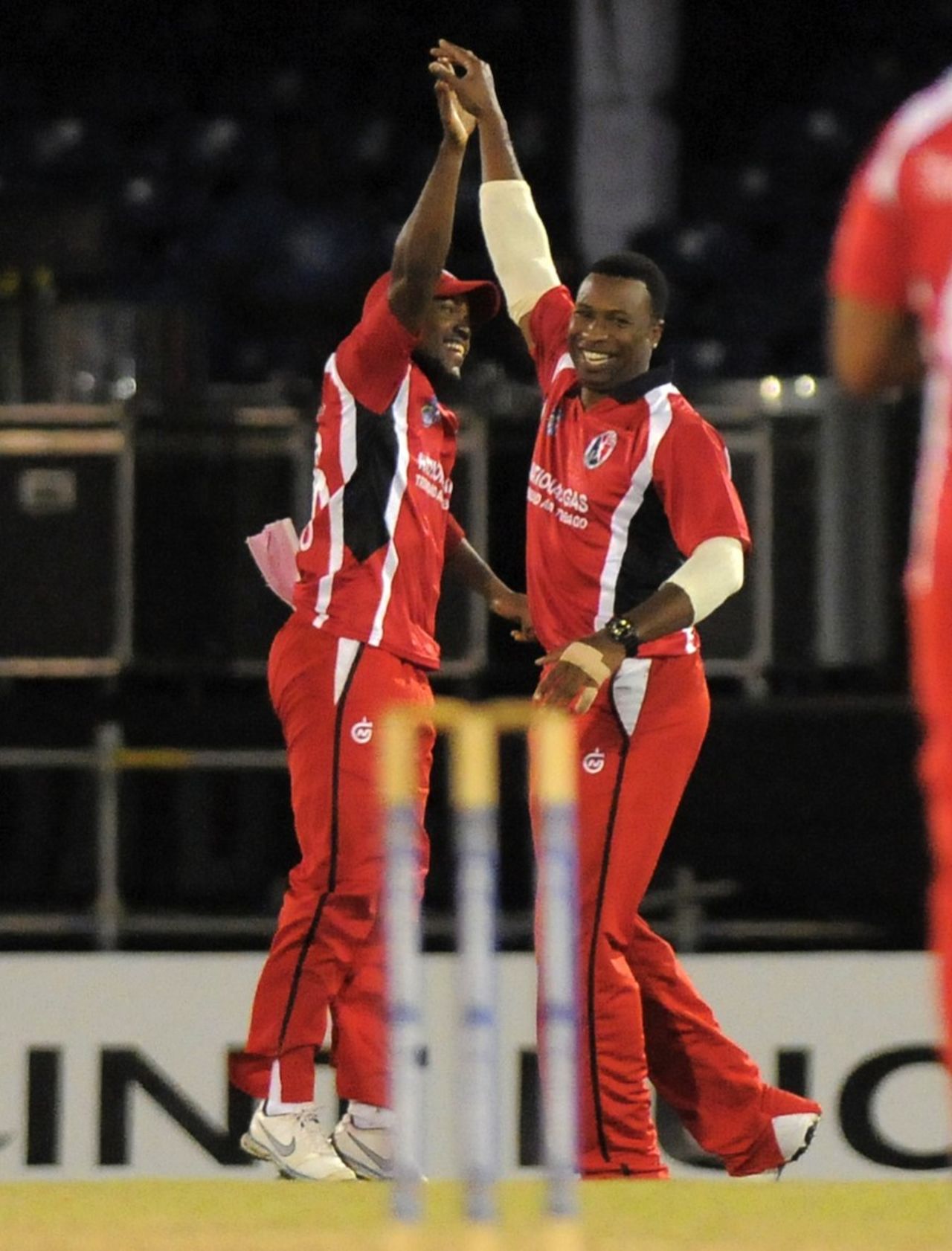 Kieron Pollard and Darren Bravo celebrate a wicket, Trinidad & Tobago v Leeward Islands, Caribbean T20, Trinidad, January 9, 2013
