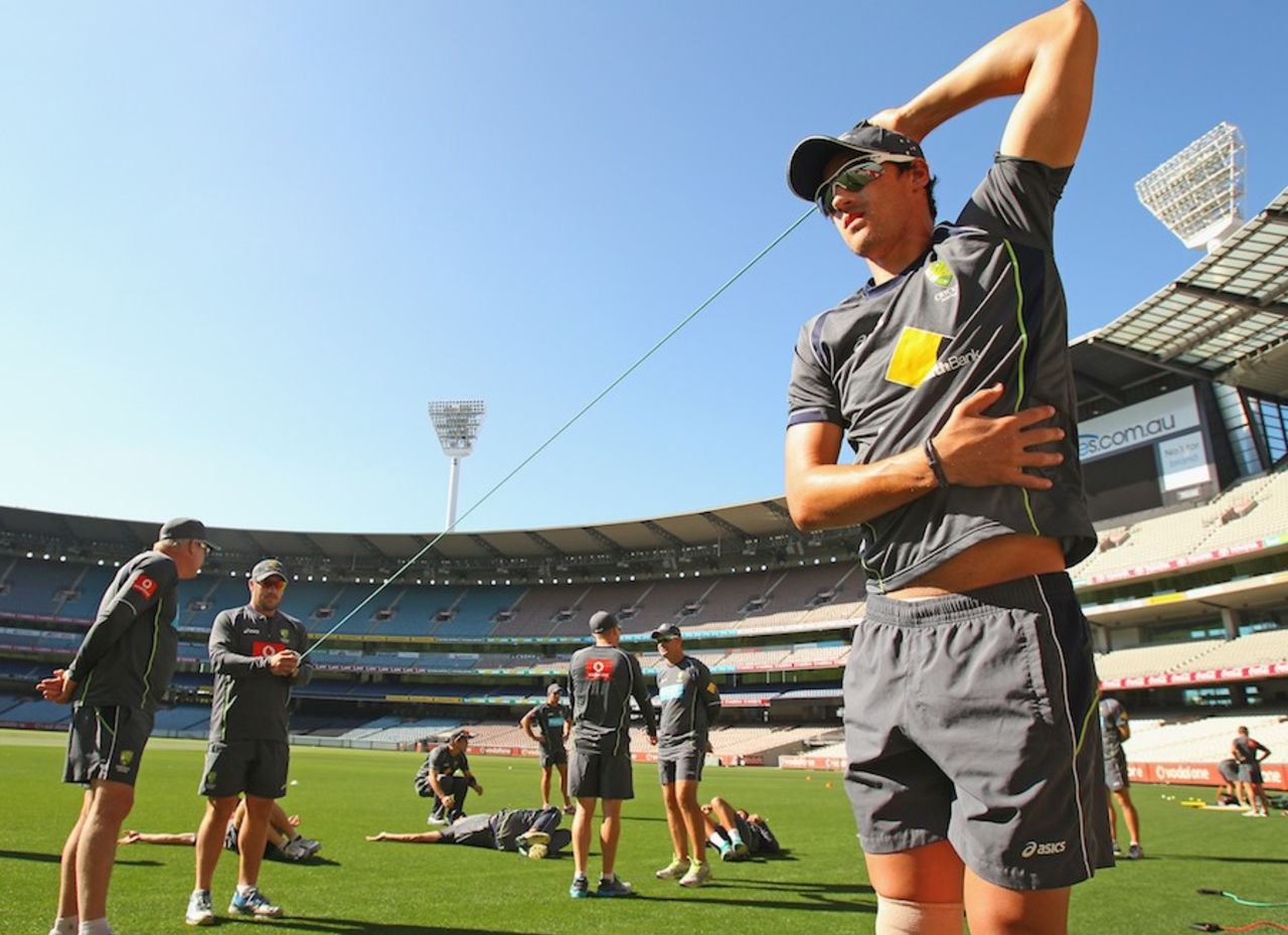 Mitchell Starc stretches at a training session on the eve of the first ODI against Sri Lanka, Melbourne, January 10, 2013