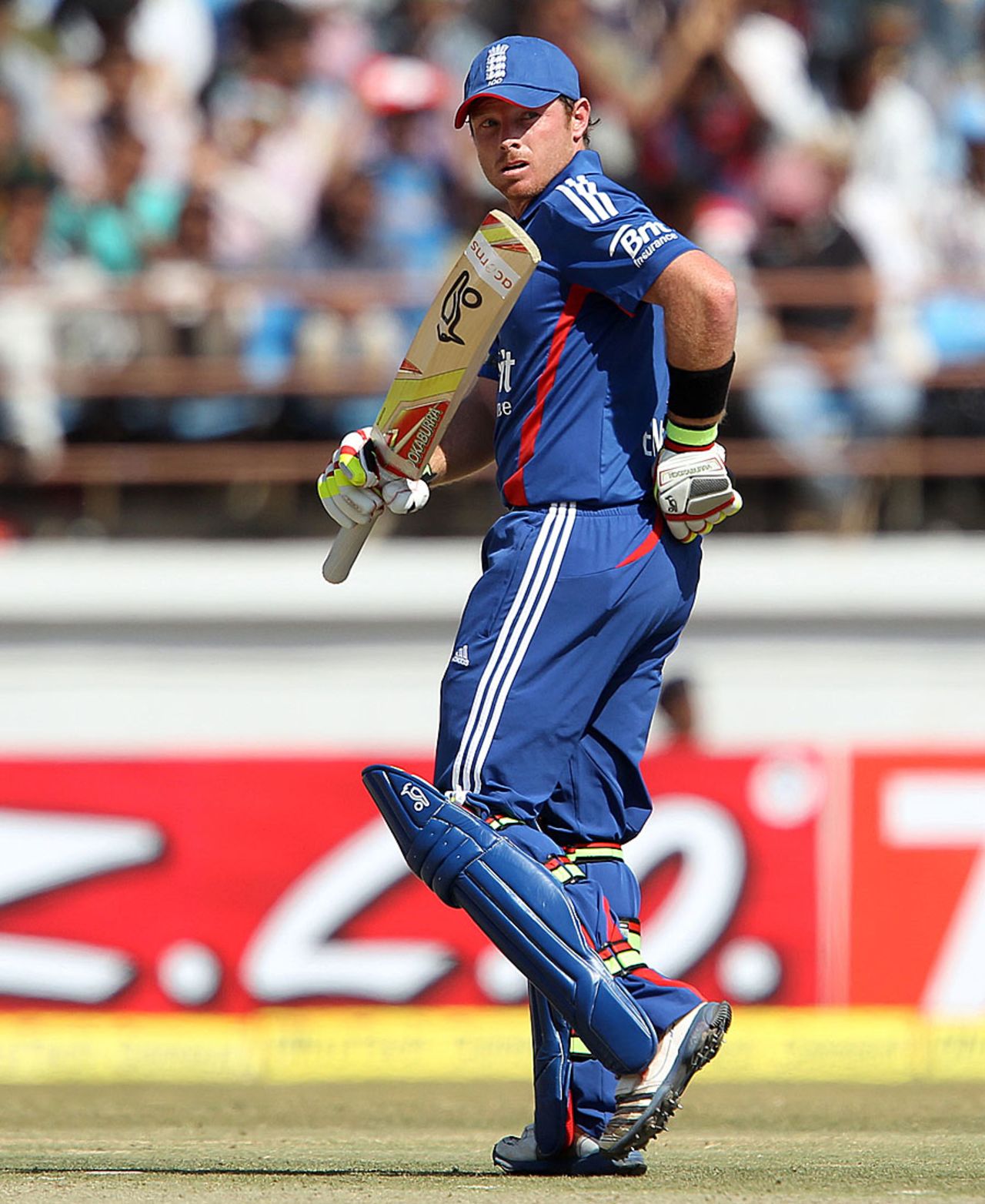 Ian Bell raises his bat after scoring a fifty, India v England, 1st ODI, Rajkot, January 11, 2013