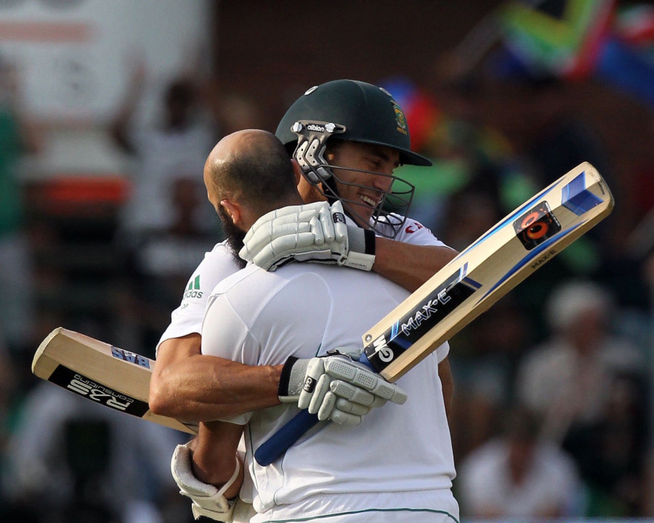 Hashim Amla embraces Faf du Plessis after reaching his century, South Africa v New Zealand, 2nd Test, Port Elizabeth, 1st day, January 11, 2013