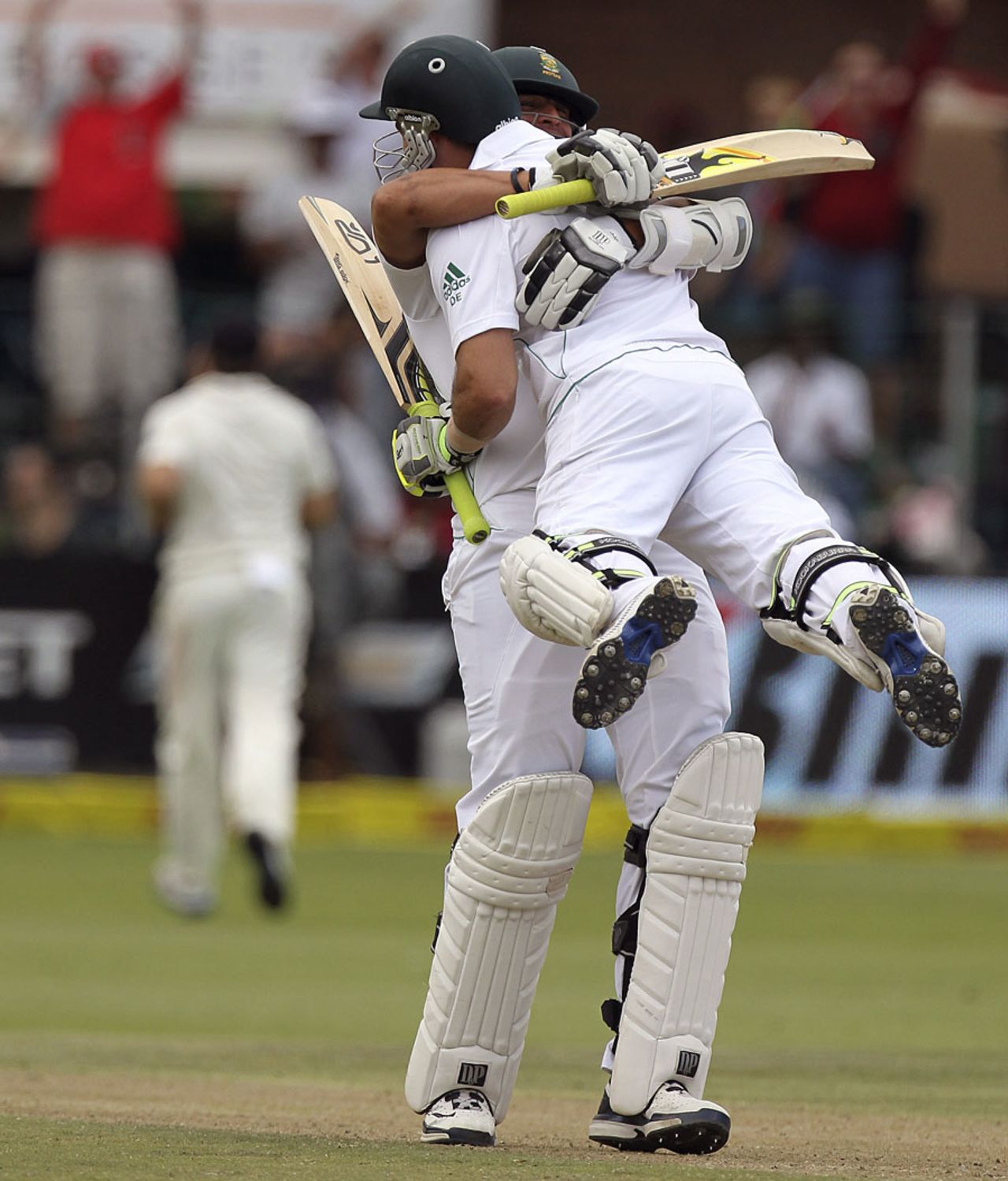 Dean Elgar gets lifted up by Rory Kleinveldt after reaching his hundred, South Africa v New Zealand, 2nd Test, Port Elizabeth, 2nd day, January 12, 2013