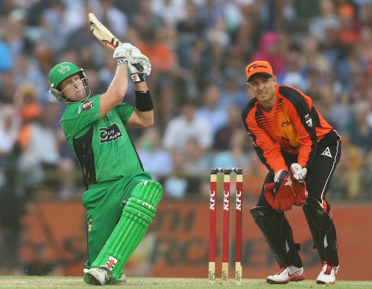 Cameron White slogs over the leg side as Michael Hussey keeps wicket, Perth Scorchers v Melbourne Stars, BBL semi-final, Perth, January 16, 2013