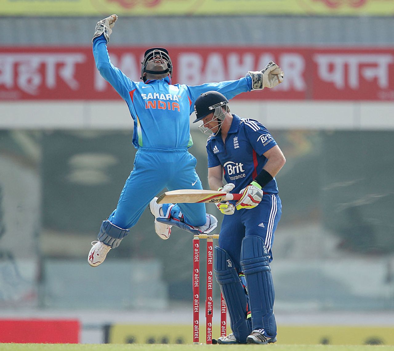 MS Dhoni leaps after getting Ian Bell out caught, India v England, 3rd ODI, Ranchi, January 19, 2013