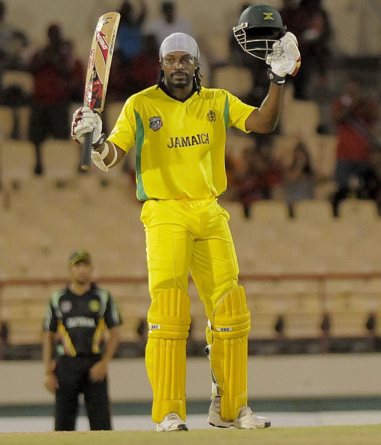 Chris Gayle acknowledges the applause after reaching his century, Jamaica v Guyana, Caribbean T20, playoff, St Lucia, January 19, 2013