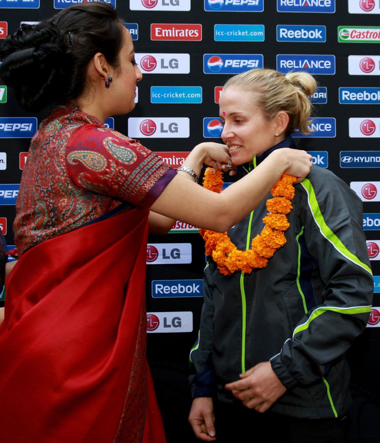Australia's Jodie Fields gets a garland at the Women's World Cup welcome ceremony, Mumbai, January 26, 2013