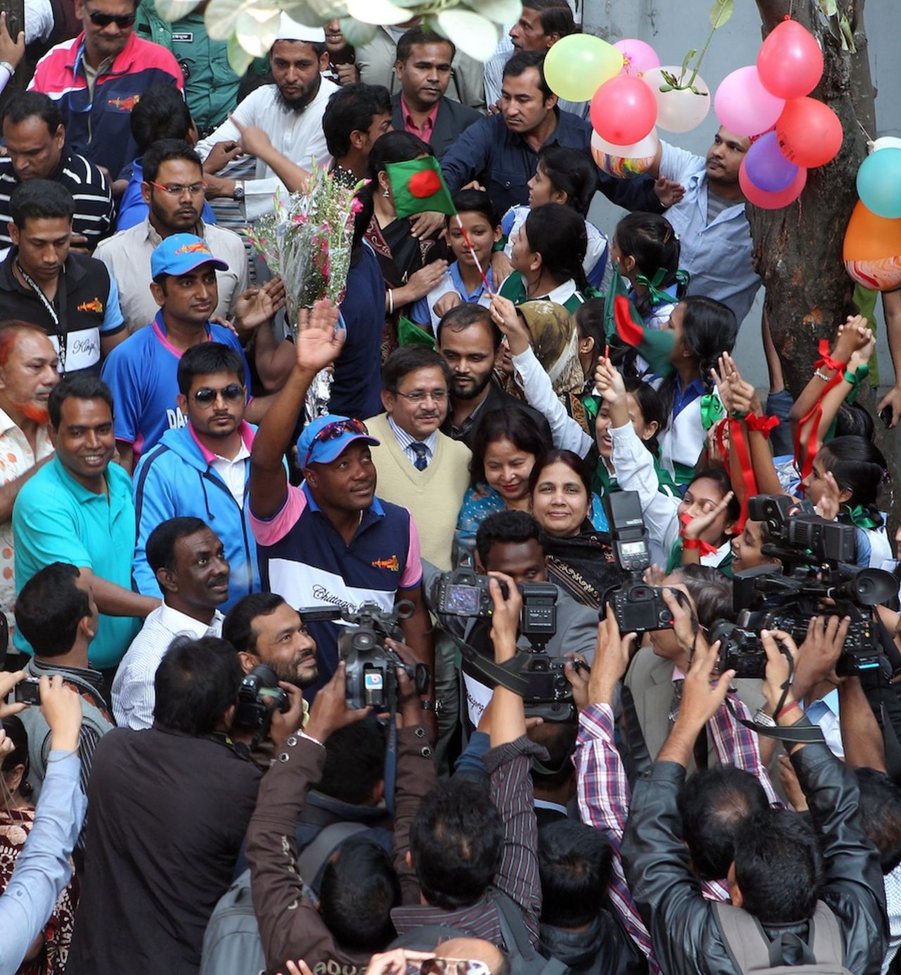 Brian Lara gets mobbed during a visit to a local school, Chittagong, January 29, 2011