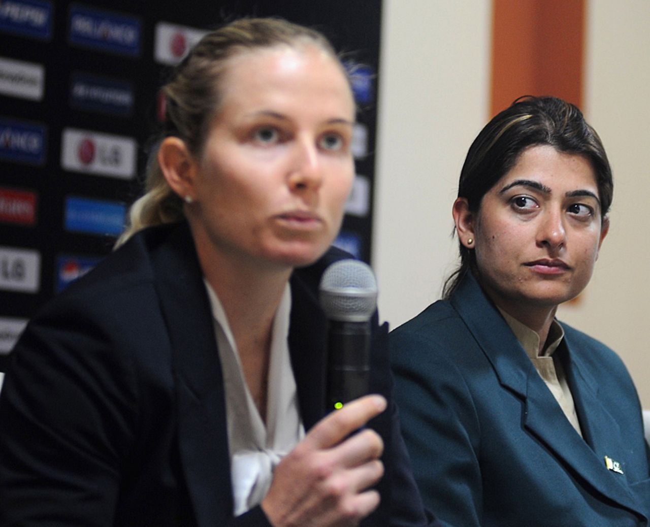 Australia's captain Jodie Fields, seated beside Sana Mir, talks at a press meet, Cuttack, January 31, 2013