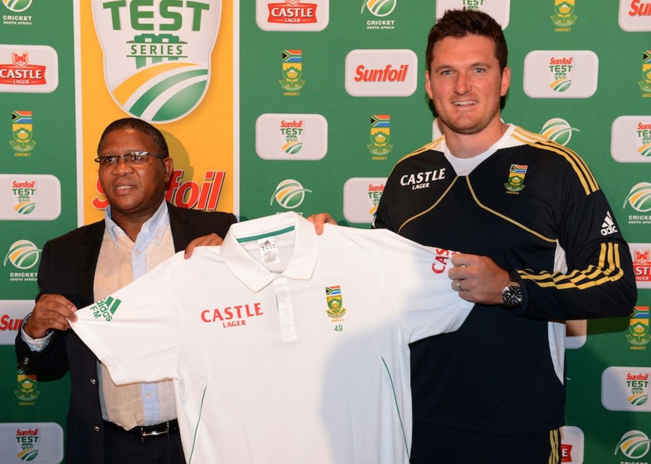 South Africa's minister for sport and recreation Fikile Mbalula gets a Test shirt from Graeme Smith, Johannesburg, January 31, 2013