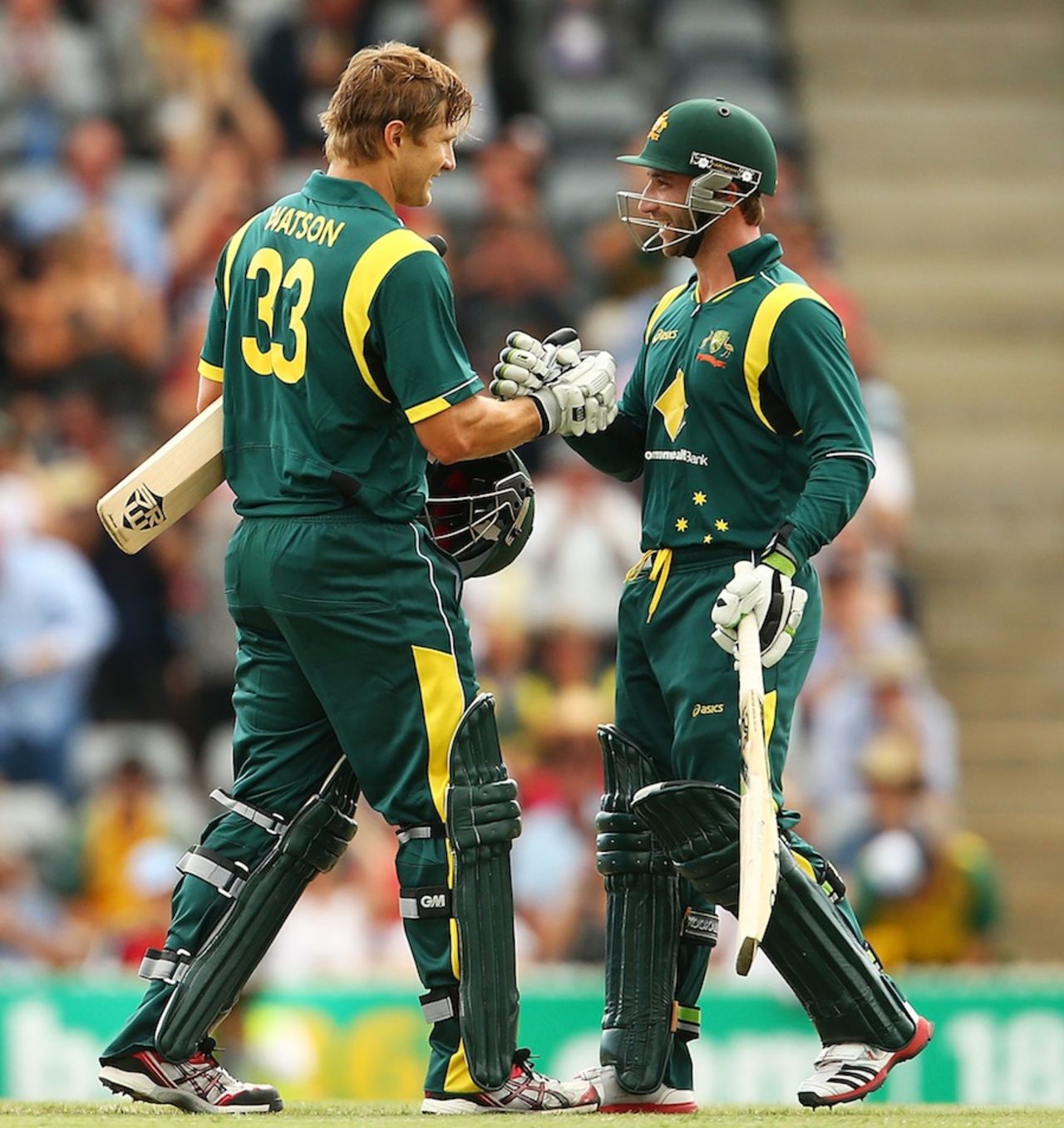 Shane Watson is congratulated by Phillip Hughes, Australia v West Indies, 3rd ODI, Canberra, February 6, 2012