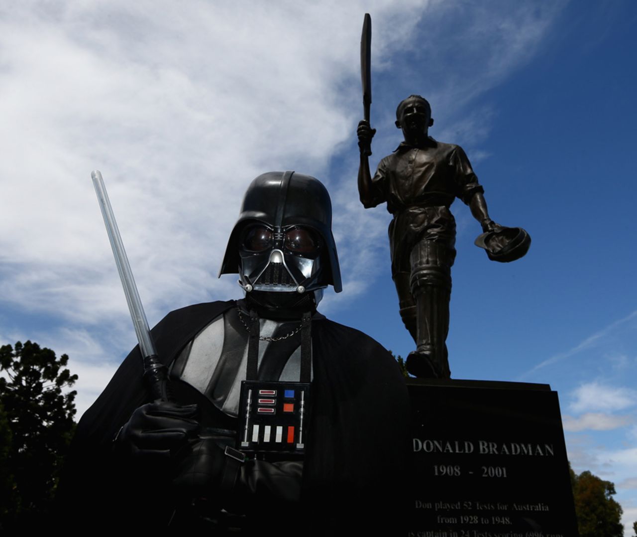 A fan dressed as Darth Vader poses in front of a Don Bradman statue, Australia v West Indies, 5th ODI, Melbourne, February 10, 2013