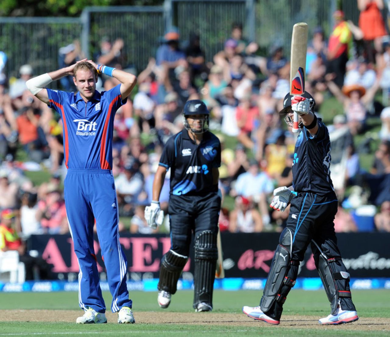 Brendon McCullum acknowledges his fifty as Stuart Broad looks on, New Zealand v England, 2nd ODI, Napier, February 20, 2013