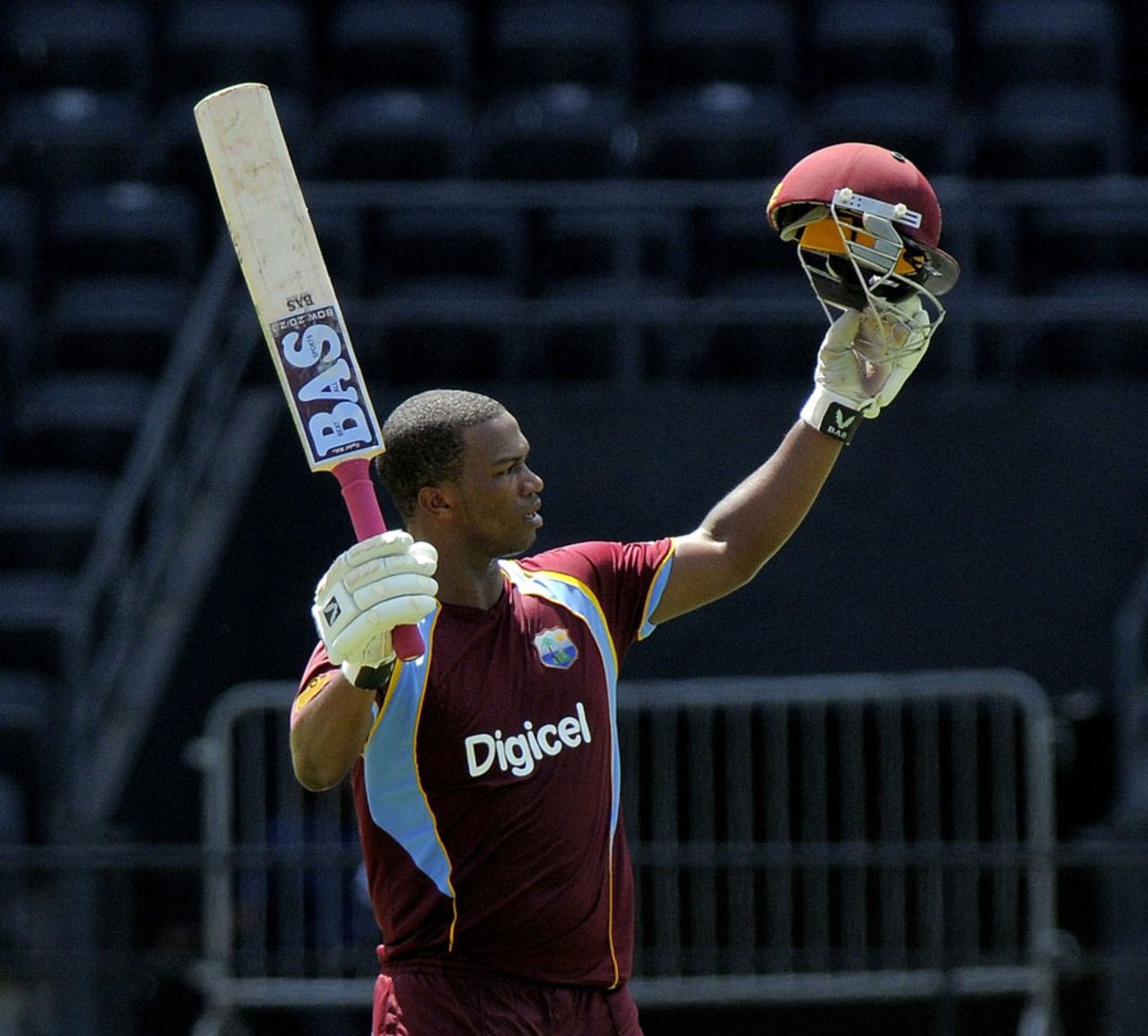 Johnson Charles raises his bat after completing an aggressive century, West Indies v Zimbabwe, 1st ODI, Grenada, February 22, 2013