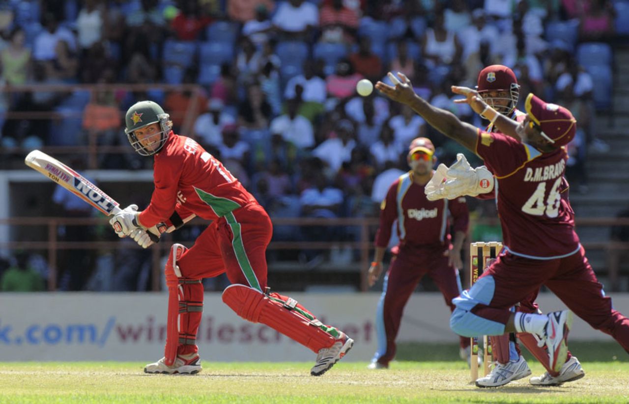 Craig Ervine gets the ball past Darren Bravo, West Indies v Zimbabwe, 1st ODI, Grenada, February 22, 2013