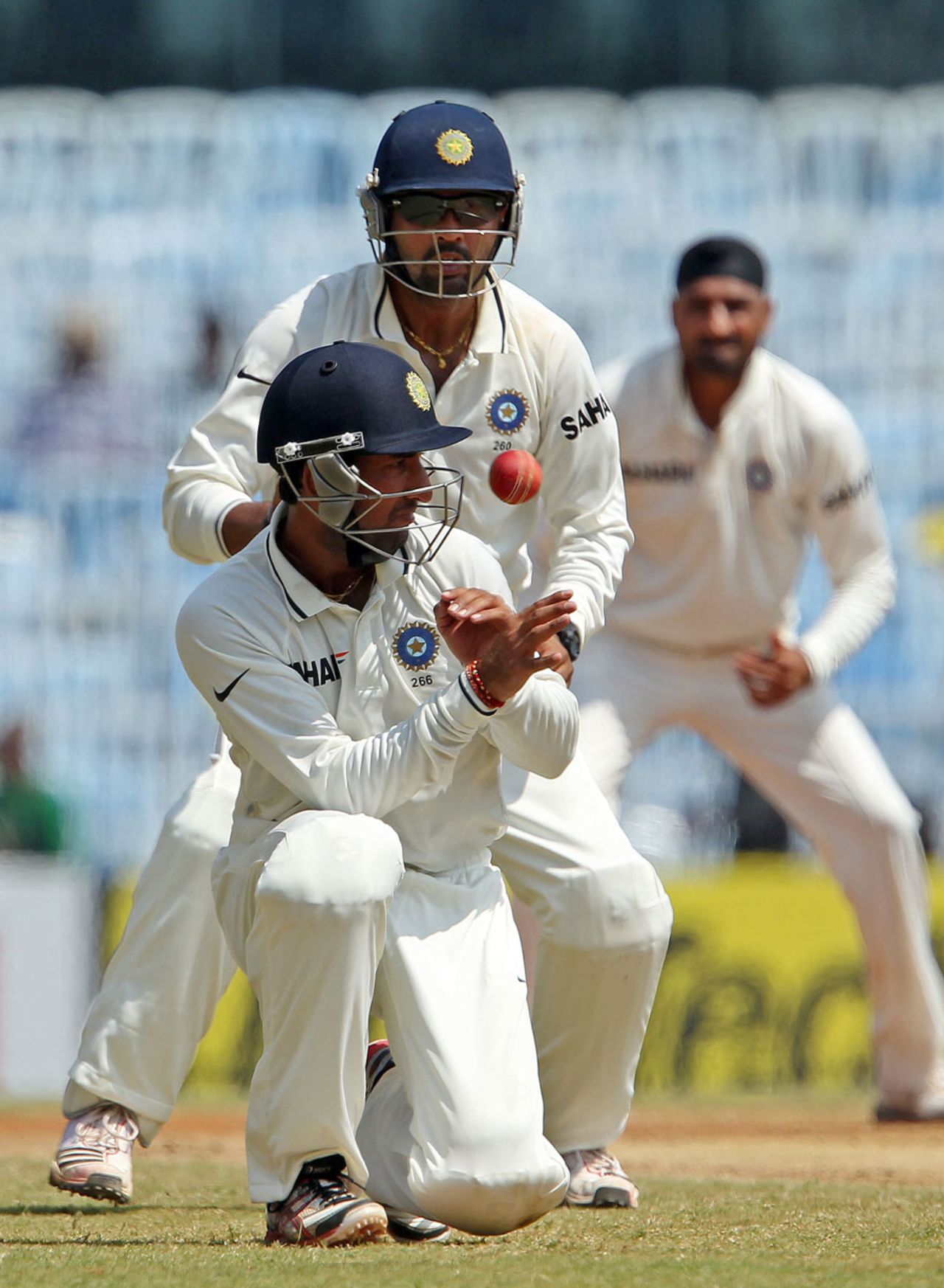 The ball whizzes past close-in fielder Cheteshwar Pujara, India v Australia, 1st Test, Chennai, 4th day, February 25, 2013