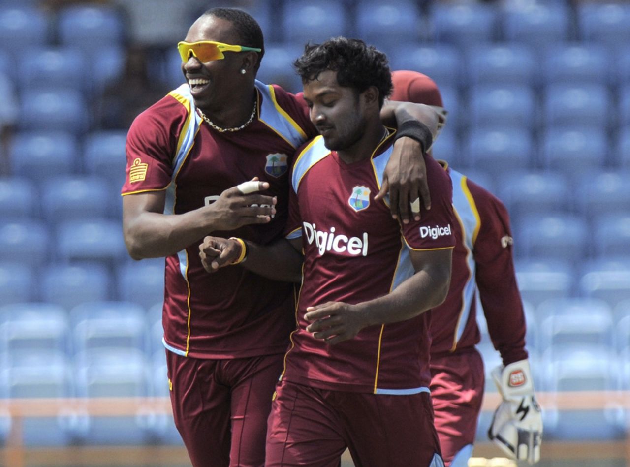 Veerasammy Permaul is congratulated by his captain Dwayne Bravo after a strike, West Indies v Zimbabwe, 3rd ODI, Grenada, February 26, 2013