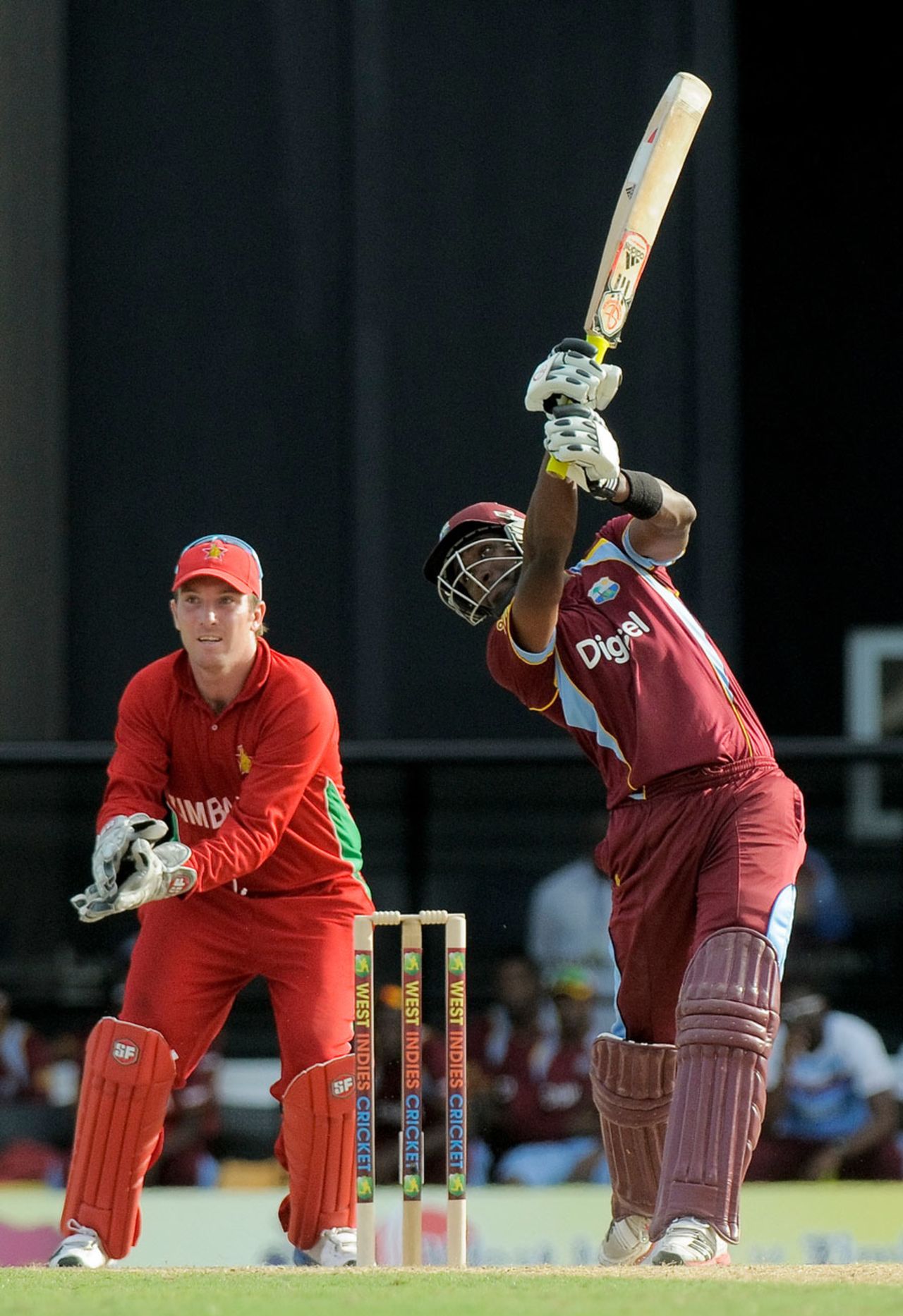 Dwayne Bravo launches one through the offside, 1st T20I, North Sound, March 2, 2013