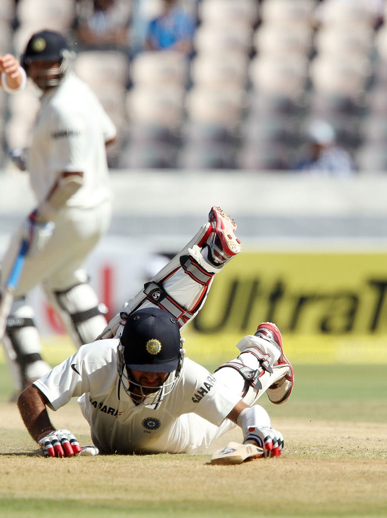 Cheteshwar Pujara hurt his knee while diving to make his ground, India v Australia, 2nd Test, Hyderabad, 2nd day, March 3, 2013