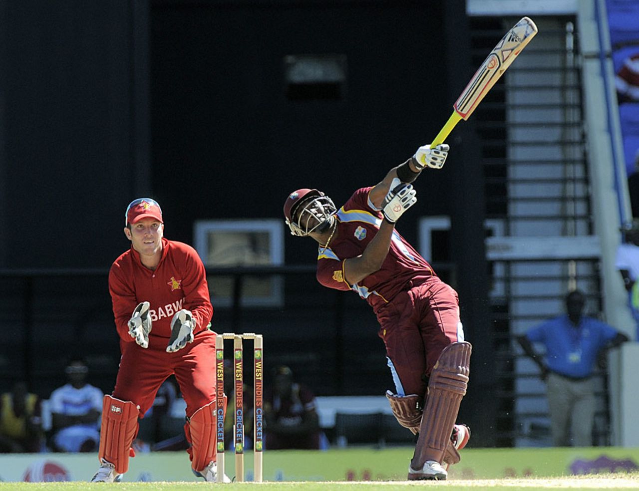 Dwayne Bravo lofts one-handed but still clears the rope, West Indies v Zimbabwe, 2nd T20I, Antigua, March 3, 2013