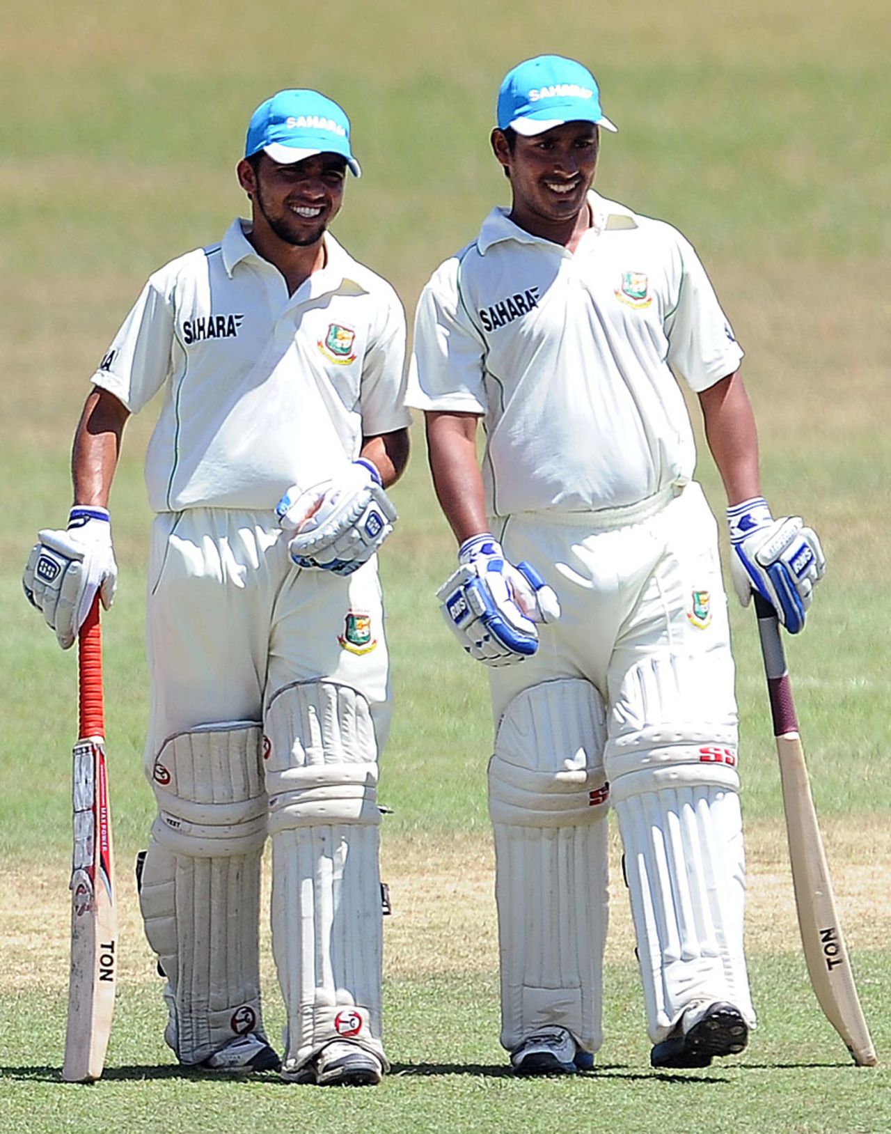 Mominul Haque (left) and Mohammad Ashraful take a break, Sri Lanka Development Emerging Team v Bangladeshis, Day 3, Matara, March 5 2013