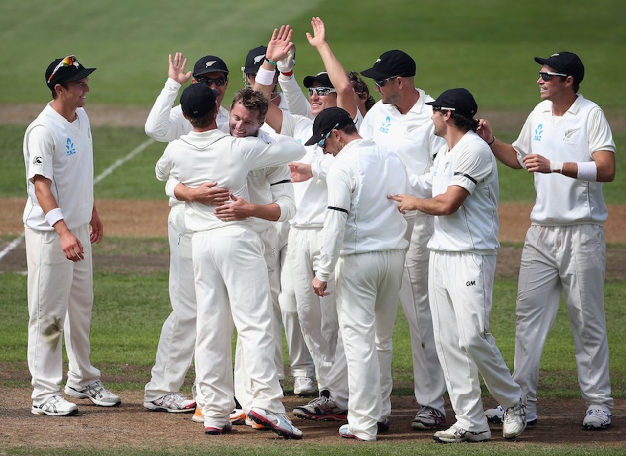 Bruce Martin is congratulated by teammates after his first Test wicket, New Zealand v England, 1st Test, Dunedin, 2nd day, March 7, 2013