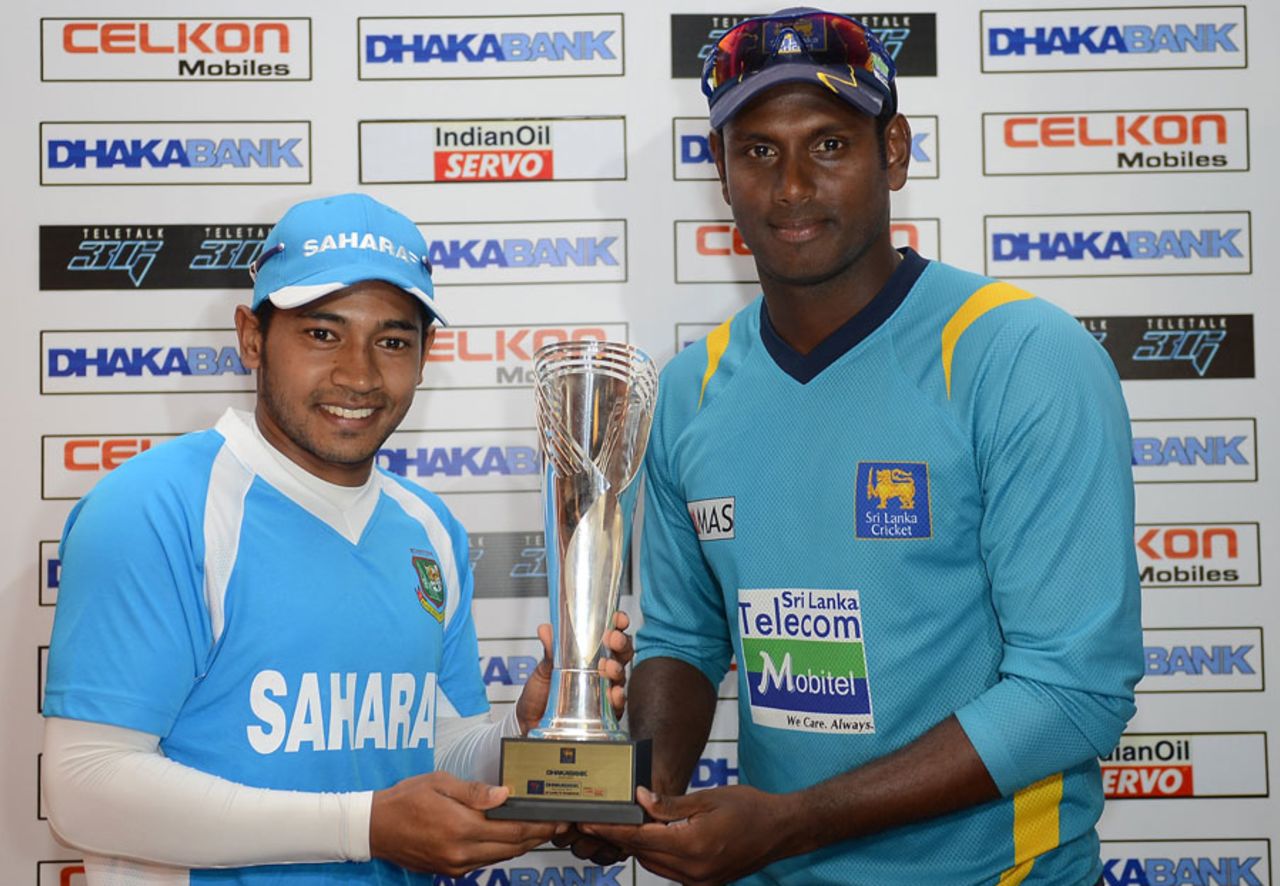 Mushfiqur Rahim and Angelo Mathews pose with the series trophy, Galle, March 7, 2013