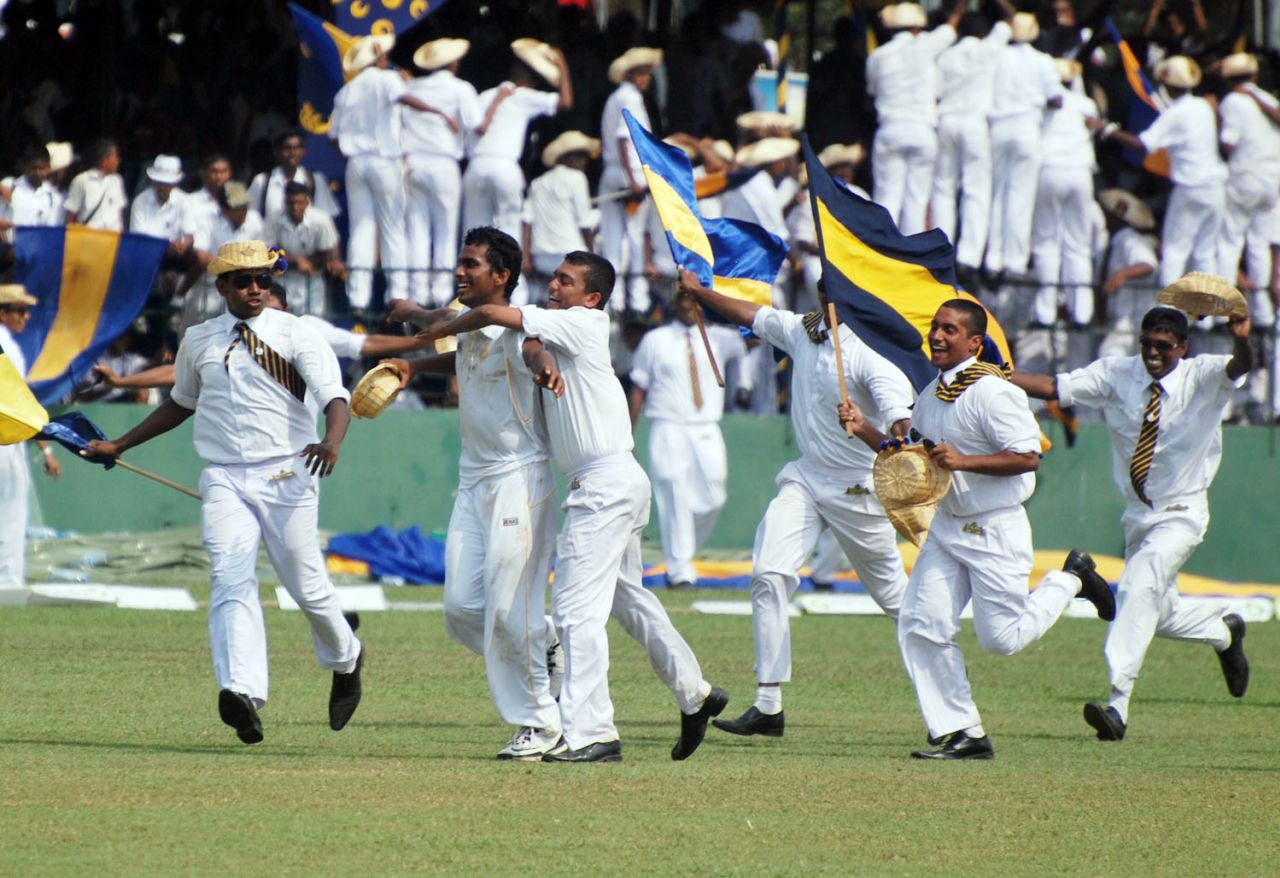 Chamika Karunaratne is swarmed by teammates and fans, S. Thomas' College v Royal College, Colombo, 1st Day, March 7, 2013