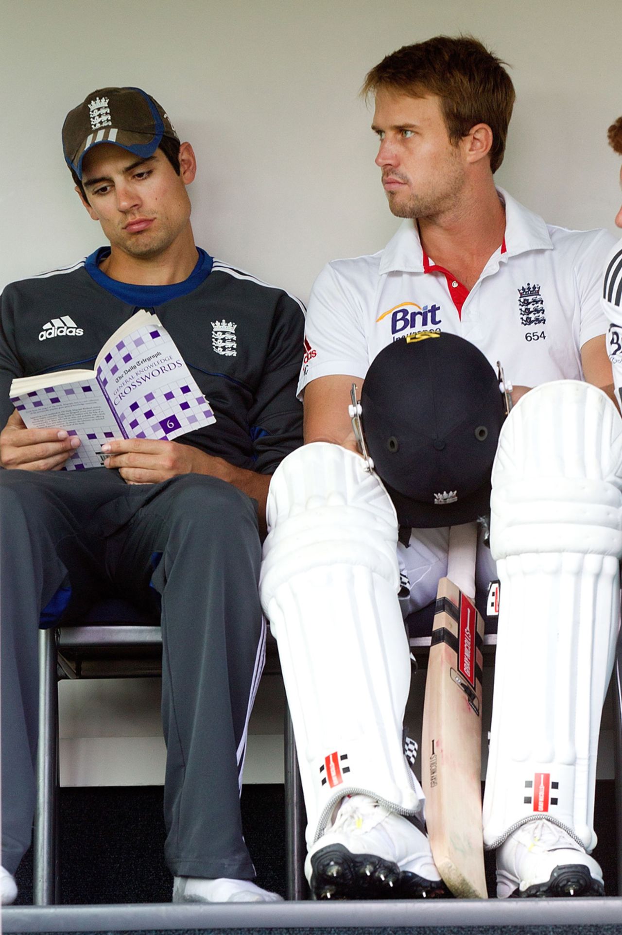 Alastair Cook reads a book on crosswords while Nick Compton waits for the start of play, New Zealand v England, 1st Test, Dunedin, 5th day, March 10, 2013