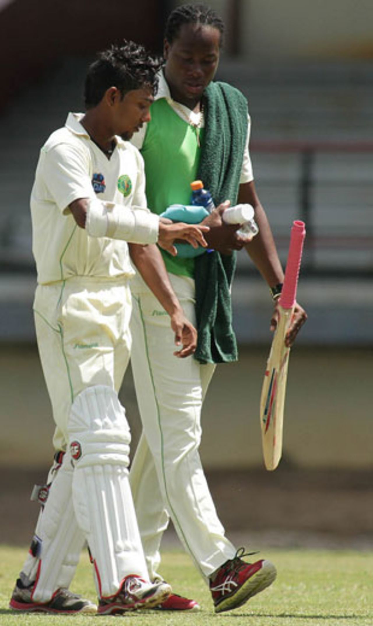 Devendra Bishoo walks off after being struck on the hand, Trinidad &Tobago v Guyana, Regional Four Day Competition, Day 4, Port of Spain March 9, 2013